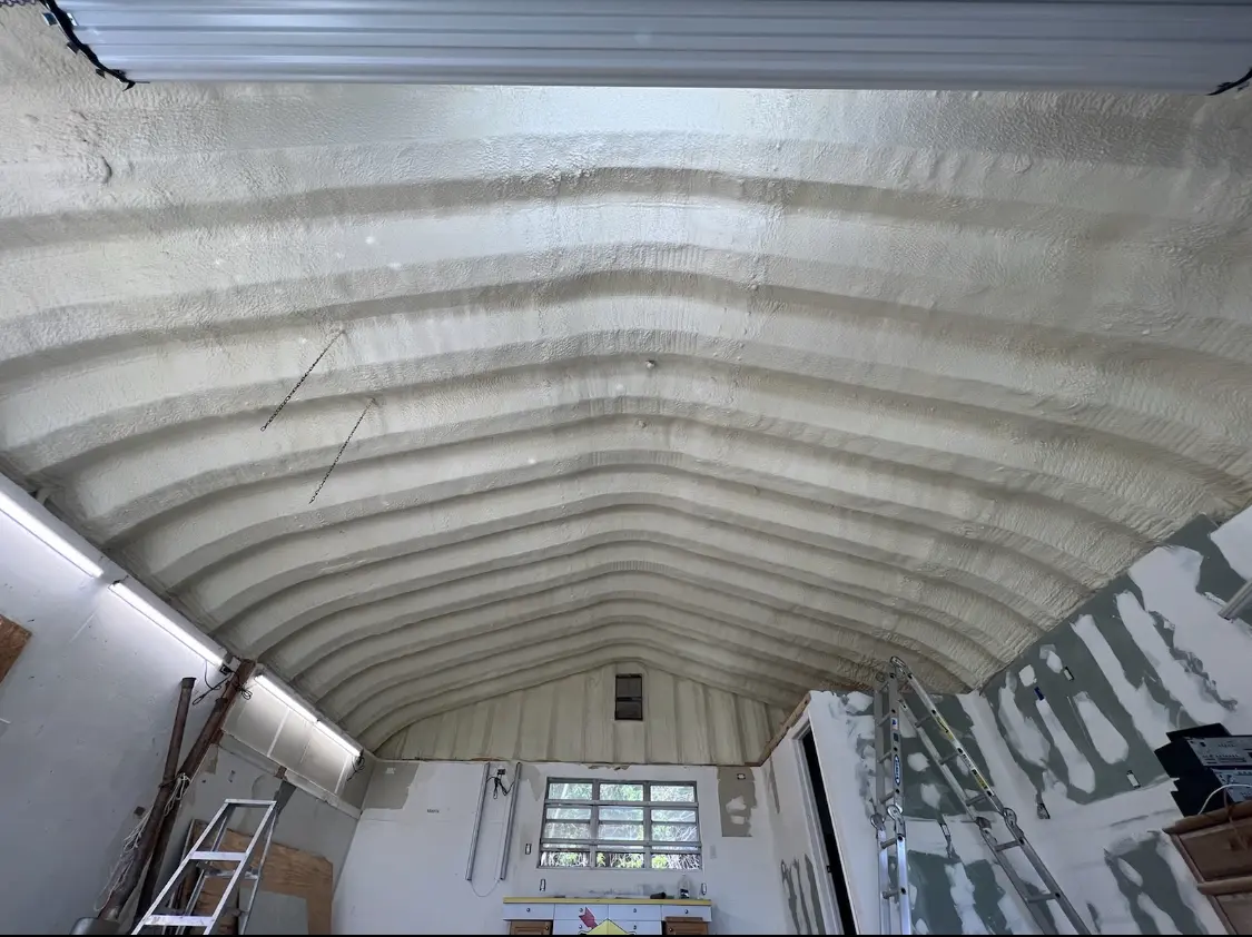 Spray polyurethane foam applied to the underside of a metal roof deck in North Potomac